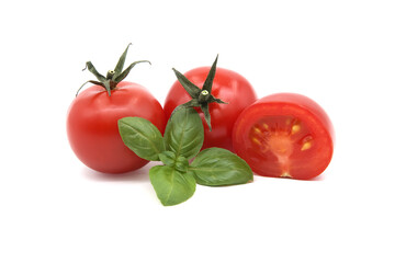 Fresh green basil leaves and cherry tomatoes isolated on white