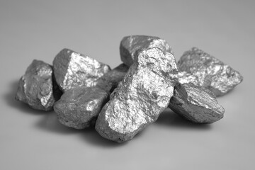 Pure platinum or silver or rare mineral from the mine on grey background