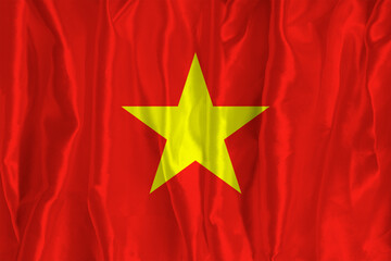 The Vietnamese flag on a silk background is a great national symbol. Texture of fabrics The official state symbol of the country