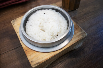 a hot pot rice. Freshly cooked Korean white rice in a stone pot.