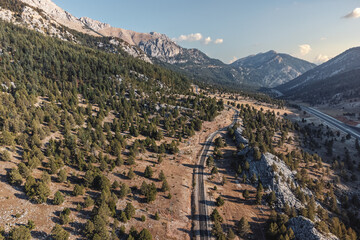 The aerial view of the scenic mountain road in Turkey is truly majestic, as it offers a breathtaking panorama of the surrounding landscape.