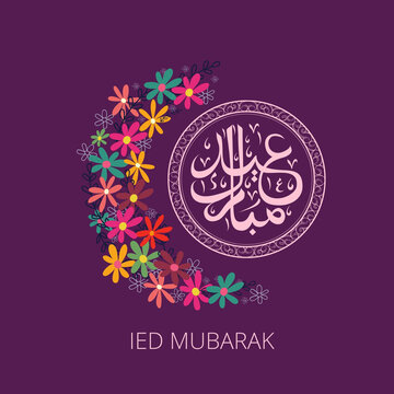Islamic greeting card ied Fitr Mubarak on flowers background.Eid Mubarak is an Arabic term that means Blessed Feast or festival.