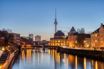 Fototapeta na wymiar The Spree river, the Bode-Museum and the TV Tower in Berlin before sunrise