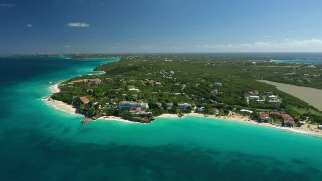 Aerial Drone view of a beautiful sandy beach in a caribbean tropical island with blue turquoise water. West End village, Meads Bay in Anguilla
