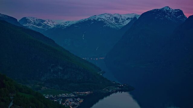 Purple sky above majestic fjord of Norway, fusion time lapse