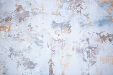 Gray background of decorative plaster with abstract spots. Unusual silver wall texture with beautiful patterns, creative surface background. Dressing coating for building cladding.