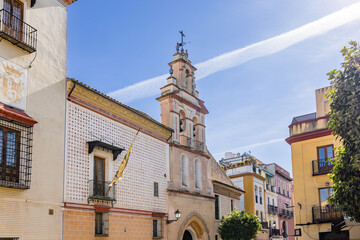 Facade of the Church of Santa Maria la Blanca in old city center of  Seville, Andalusia, Spain. Text HAC EST DOMUS DEI ET PORTA COELI 1741 means THIS IS THE HOUSE OF GOD AND THE GATE OF HEAVEN 1741 - obrazy, fototapety, plakaty
