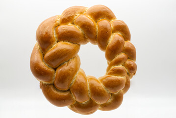 Traditional Italian bread Corona di Pasqua (Easter wreath) isolated on white background. Top view.