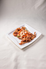 chinese and western mixed seafood combination cold platter with deep fried soft shell crab scallop salad on wood table asian banquet halal menu