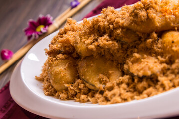 deep fried crispy eggplant vegetable and chicken floss with pepper mayonnaise sauce in white plate on red cloth wood table asian halal banquet appetiser snack menu 