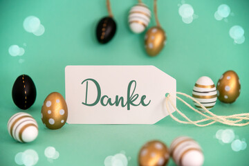 Obraz na płótnie Canvas Golden Easter Egg Decoration. Label With German Text Danke Means Thank You