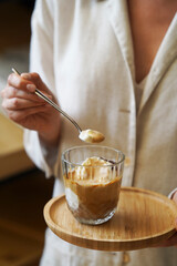 Woman hands holding affogato coffee and ice cream