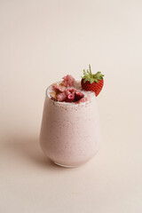 Glass of strawberry milkshake with whipped cream