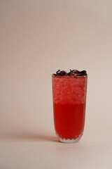 Summer cocktail with blackberry on light background.