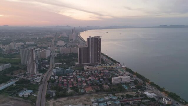 Aerial view of Pattaya sea, beach in Thailand in summer season, urban city with blue sky for travel background. Chon buri skyline.