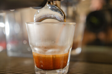 Making espresso coffee by a barista