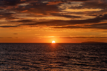 Fototapeta premium Nice sunset with shining sun with rays on Mali Losinj in Croatia