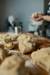 Raw cookies preparation on wooden table selective focus