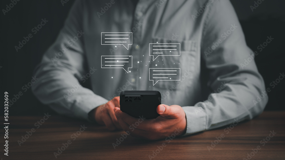 Poster Young man hand using a smartphone typing live chat chatting on application communication digital web and social network concept. Social media application chat box on mobile phone.
