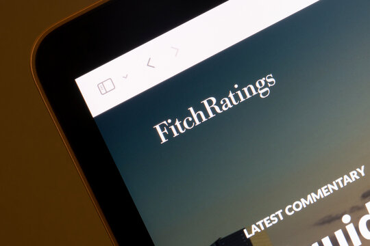 Portland, OR, USA - Mar 16, 2023: Website homepage of Fitch Ratings is seen on a computer. Credit rating agency Fitch says liquidity pressures are unfolding rapidly for some but not all U.S. banks.