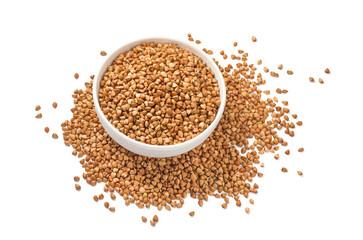 Full buckwheat bowl in the middle of buckwheat pile isolated on white background. Top view