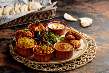 Bahraini Breakfast set with hummus, raita, salad, gravy, vegetable and bread served in dish isolated on table top view of arabic breakfast