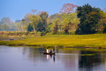 Autumn landscape with a boat. Majuli is the world's most oversized river island on the bank of the Brahmaputra River, Assam.