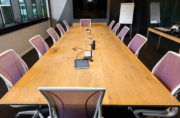 Empty boardroom table and chairs