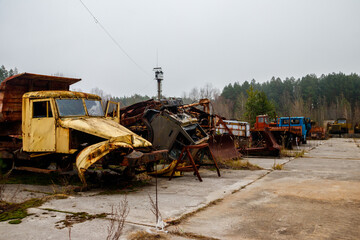 Old rusty abandoned damaged trucks in Chernobyl exclusion zone, Ukraine