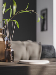 3d ceramic display podium with plant vase and diffuser on wooden table in bedroom. 3d rendering of realistic presentation for product advertising. 3d minimal illustration.