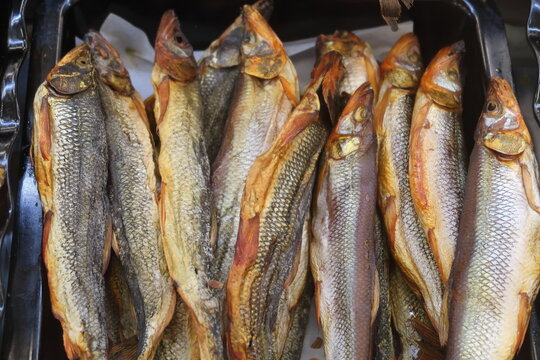 top view of dried salted pike, several fish for sale, fish delicacies, beer snacks.