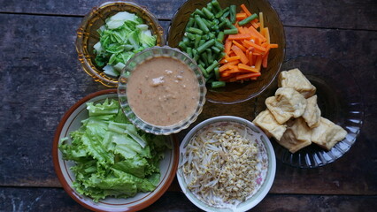 Gado-gado is mixed boiled vegetables with peanut souce dressing, traditional indonesian food. 
