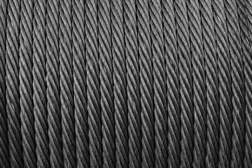 Steel rope is on a winch, close up, abstract industrial background