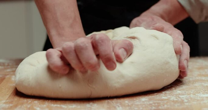 Man kneading dough