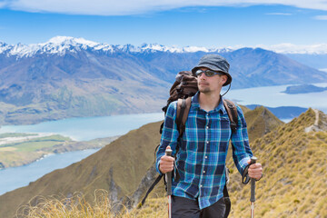 Fototapeta na wymiar hiker looking at the horizon. Wanaka lake. New Zealand