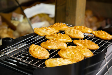 Traditional polish cuisine grilled cheese. Street food market Jarmark St. Dominic in Gdansk Poland. Outdoor Market. Food Event. Food Fair. Festival outdoor cheese on grill. Travel tourist destination