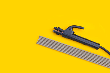 Welding equipment on yellow background.