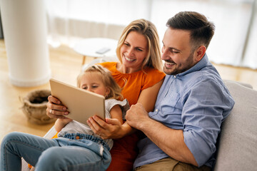 Device technology family online education concept. Happy family with digital devices at home.