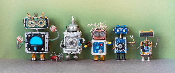 Five steampunk toy robots and small dog. Metal copper silver texture characters lined up in a row. A group of robots of different height, color, style and material