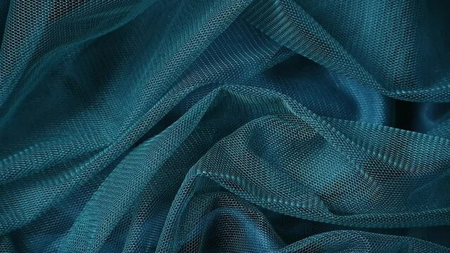 Wavy fabric in blue colors, monochromatic colors, futuristic design
