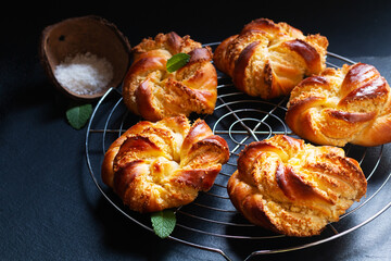 Food concept Homemade inside out hong kong coconut bun on black background with copy space