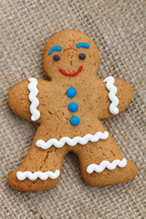 Obraz na płótnie Canvas Gingerbread man cookie baked for holiday. Cute pastry item made at home