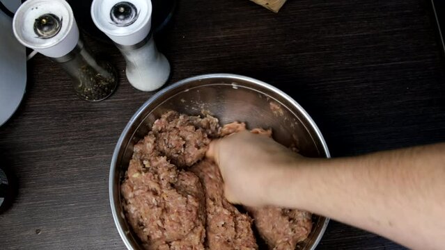 cooking meatballs mixing forcemeat overhead in bowl