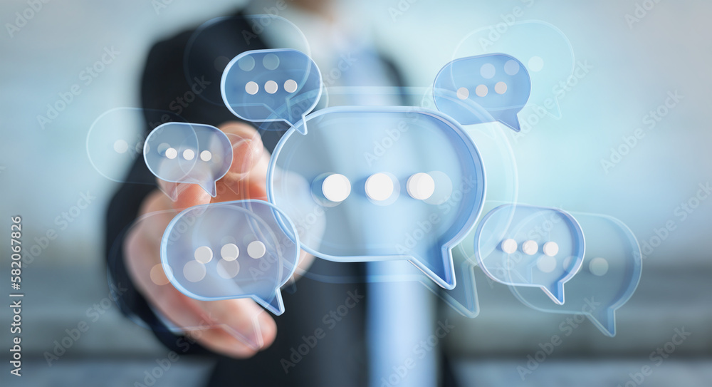 Wall mural man touching with his fingers digital speech bubbles talk icons. minimal conversation or social medi