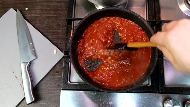 Cooking At Domestic Kitchen Overhead View Red Tomatoes Sauce On Frying Pan