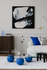 Modern composition of living room interior with mock up poster frame, wooden sideboard, glass coffee table, stylish sofa, blue pillow and personal accessories. Home decor. Template.