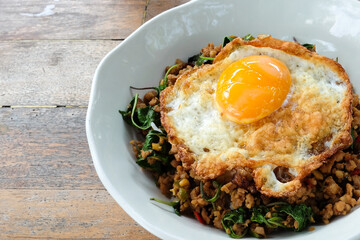 Rice topped with stir-fried minced pork and basil with fried egg.