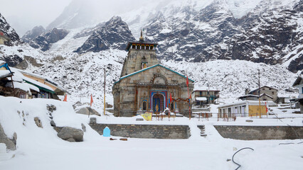 Kedarnath temple during winter and snow fall in Uttarakhand. Kedarnath temple is a Hindu temple...