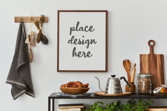 Kitchen space interior with mock up poster frame, pitcher, croissant, herbs and kitchen accessories. Home decor. Template.