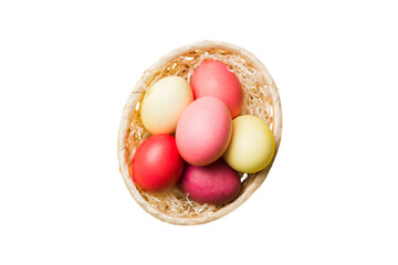 Fototapeta na wymiar Basket of colorful Easter eggs isolated on white background. Easter basket filled with colored eggs top view holiday concept